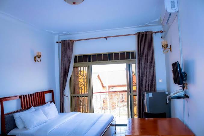 Exotic room at GoldStar Hotel Busia with AC and fridge