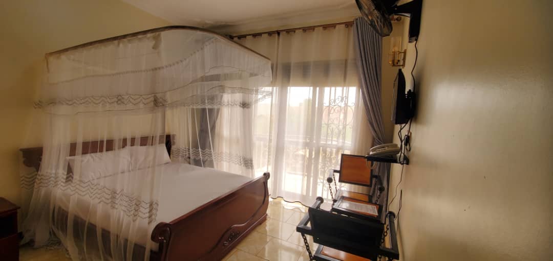 GoldStar Hotel Busia luxury room – elegant bedroom